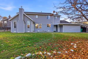 Back of house with a chimney and crawl space