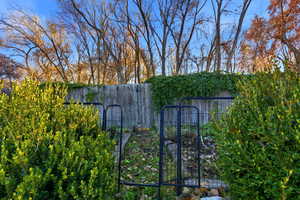 Gate featuring a vegetable garden