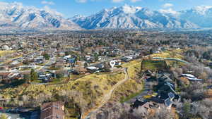 View of property location featuring a mountain backdrop and nearby suburban area