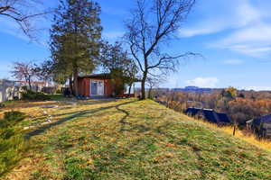 View of yard featuring an outdoor structure