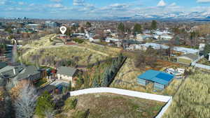 Aerial perspective of suburban area featuring a mountainous background