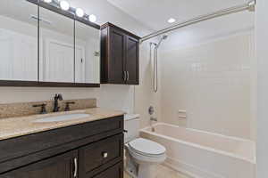 Full bath featuring vanity and shower / tub combination