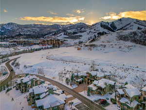 View of property location featuring a mountain backdrop and nearby suburban area