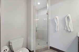 Full bath with a stall shower and vanity