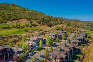 Aerial perspective of suburban area featuring a mountainous background