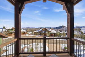 Balcony with a residential view and a mountain view from primary bedroom