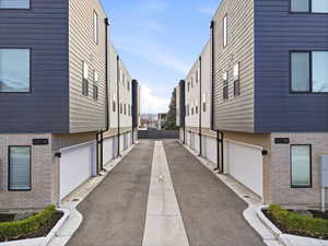 View of asphalt road with a residential view