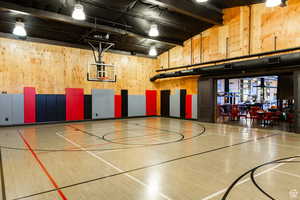 View of sport court with community basketball court and a patio