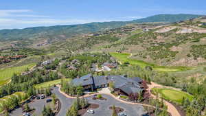 Aerial view of property's location with a mountainous background