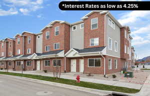 Traditional home with brick siding and roof with shingles