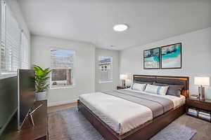 Bedroom with multiple windows