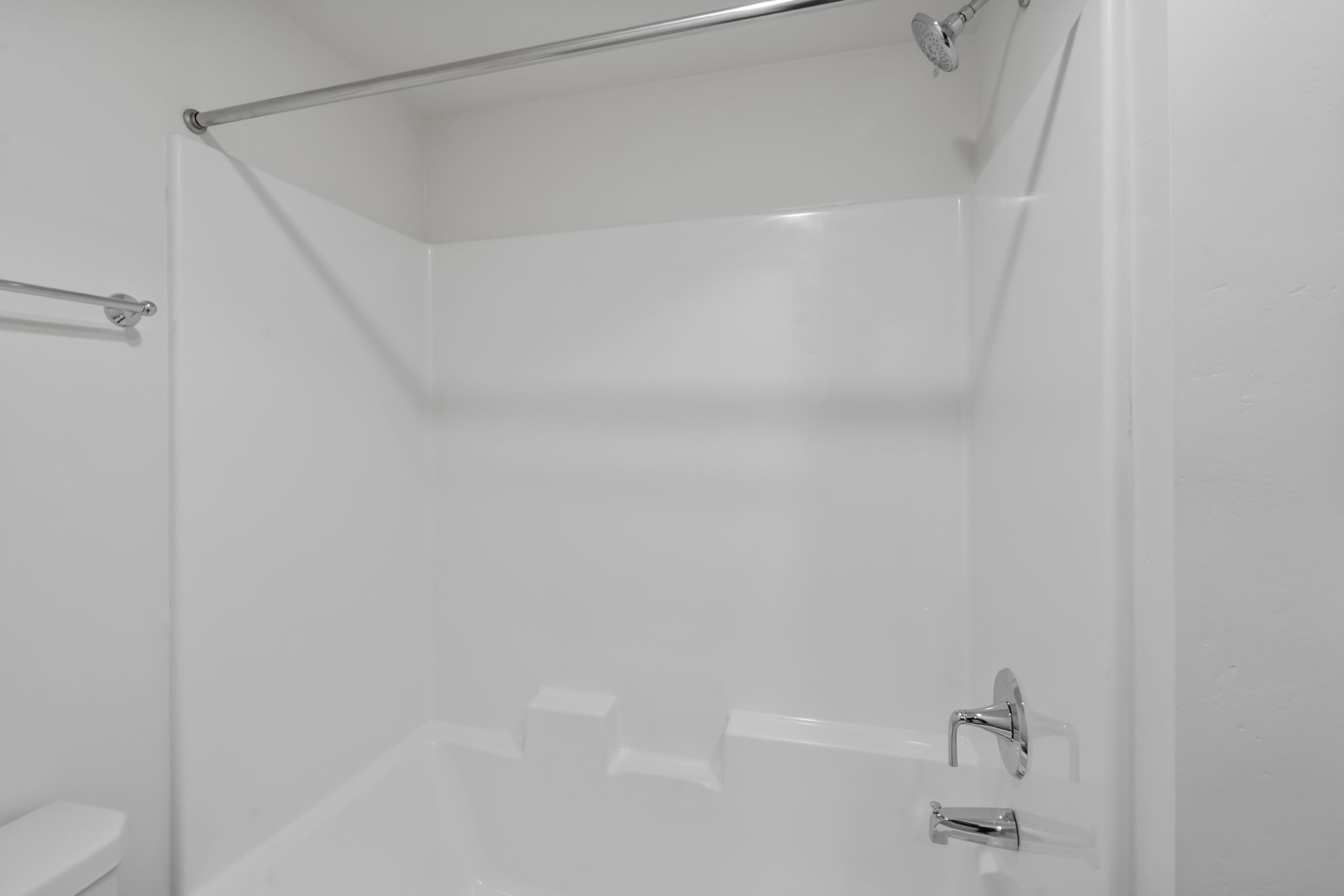 Bathroom featuring  shower combination and toilet