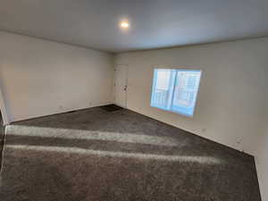 Spare room featuring carpet floors and recessed lighting