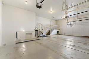 Garage featuring a garage door opener