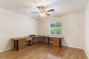 Unfurnished office with light wood-type flooring and ceiling fan