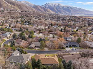 Aerial overview of property's location featuring nearby suburban area and a mountain backdrop