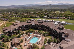 Aerial view of a mountain backdrop and a pool