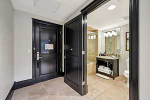 Entryway featuring baseboards and recessed lighting