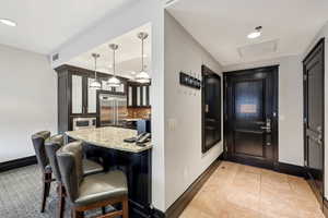 Entryway featuring baseboards and recessed lighting