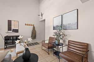 Living area with a towering ceiling