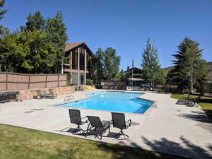 Community pool featuring a patio