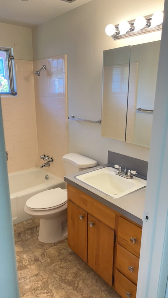 Full bathroom with vanity and shower / washtub combination