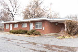 View of front facade featuring brick siding