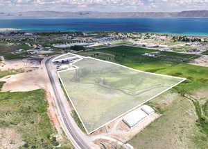 Aerial view of property's location with a water and mountain view and property parcel outlined