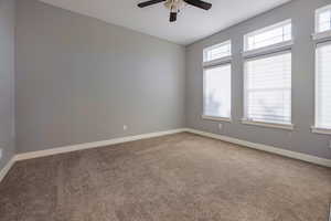 Unfurnished room with light carpet and ceiling fan