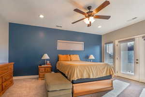 Bedroom with light carpet, access to outside, ceiling fan, an accent wall, and recessed lighting