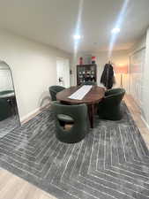 Recreation room with light wood-type flooring and baseboards