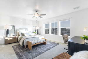 Bedroom featuring light colored carpet and ceiling fan