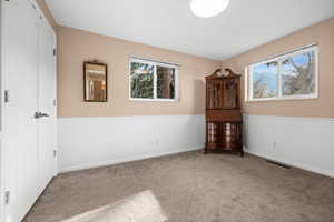 Main floor bedroom #2 with east and south facing windows