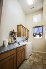 Washroom with cabinet space and separate washer and dryer