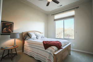 Bedroom featuring ceiling fan and carpet flooring