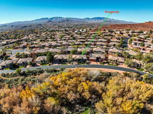 Aerial view of residential area featuring mountains