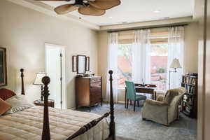 Carpeted bedroom with ceiling fan and recessed lighting