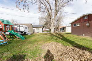 View of yard with a playground