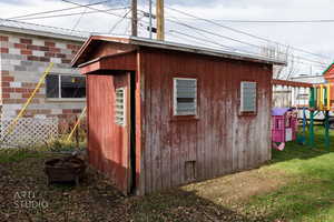 View of outbuilding with a playground
