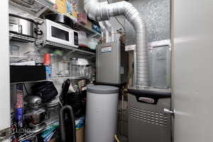 Utility room featuring heating unit
