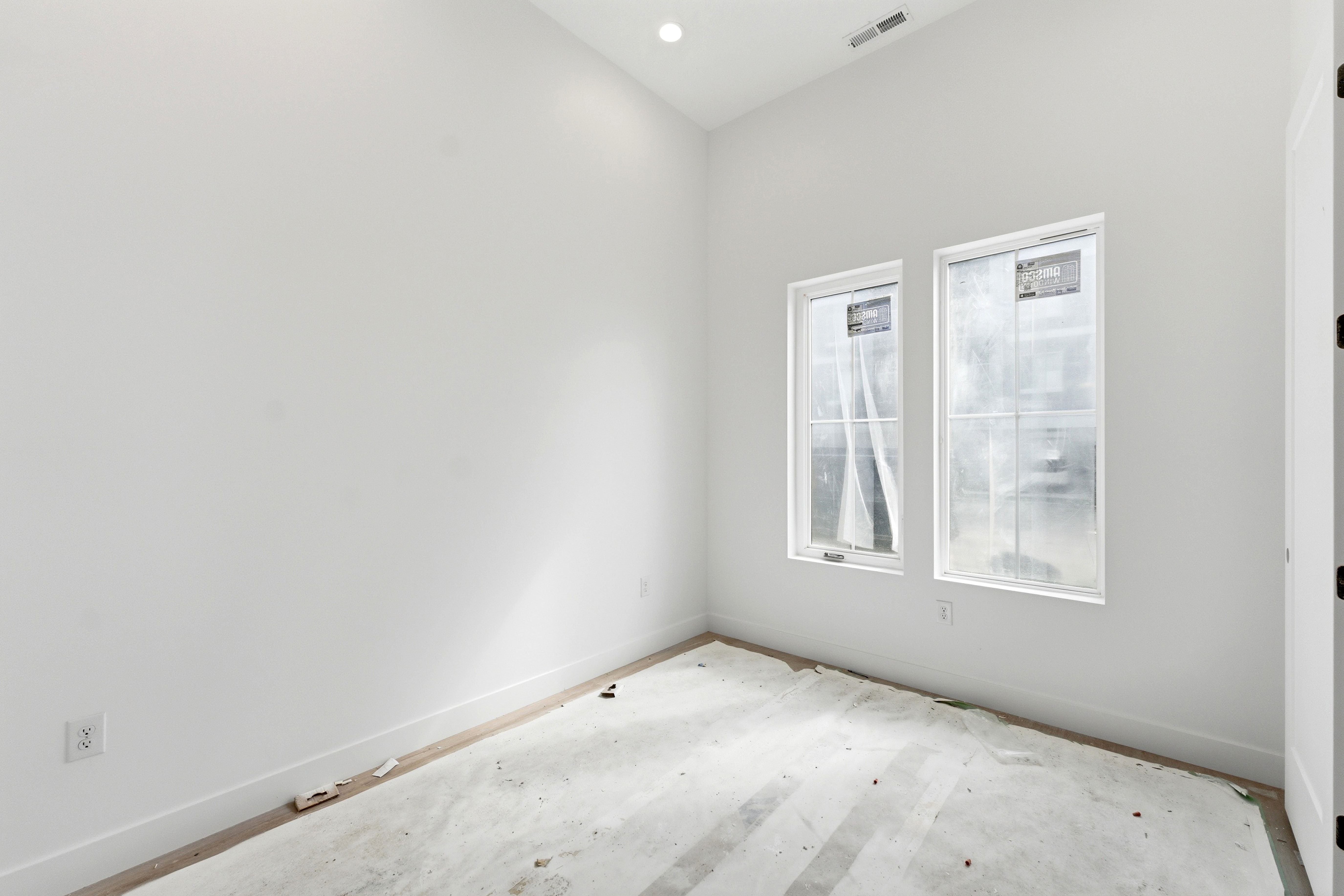 Unfurnished room with baseboards