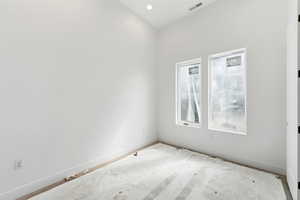 Unfurnished room with baseboards