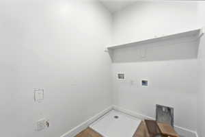 Laundry area with washer hookup and electric dryer hookup