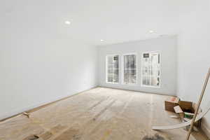 Empty room featuring baseboards