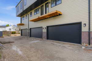 View of home's exterior with brick siding and an attached garage