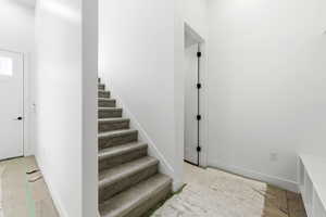 Stairs featuring baseboards