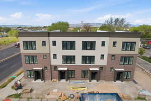 View of apartment building / complex with a mountain view