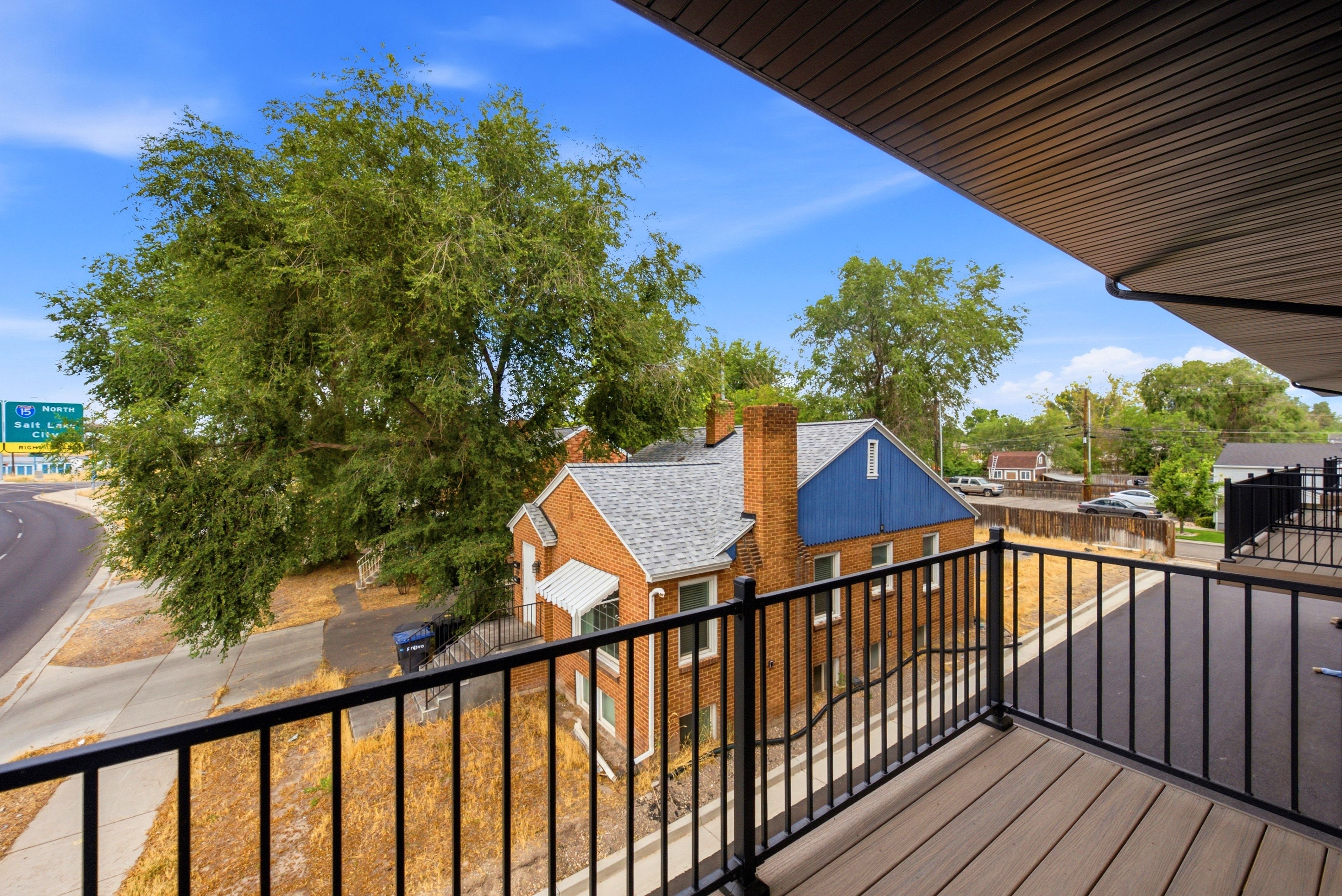 Balcony featuring composite decking and black metal railings