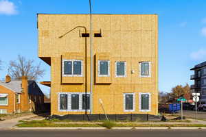 Rear view of house with stucco siding