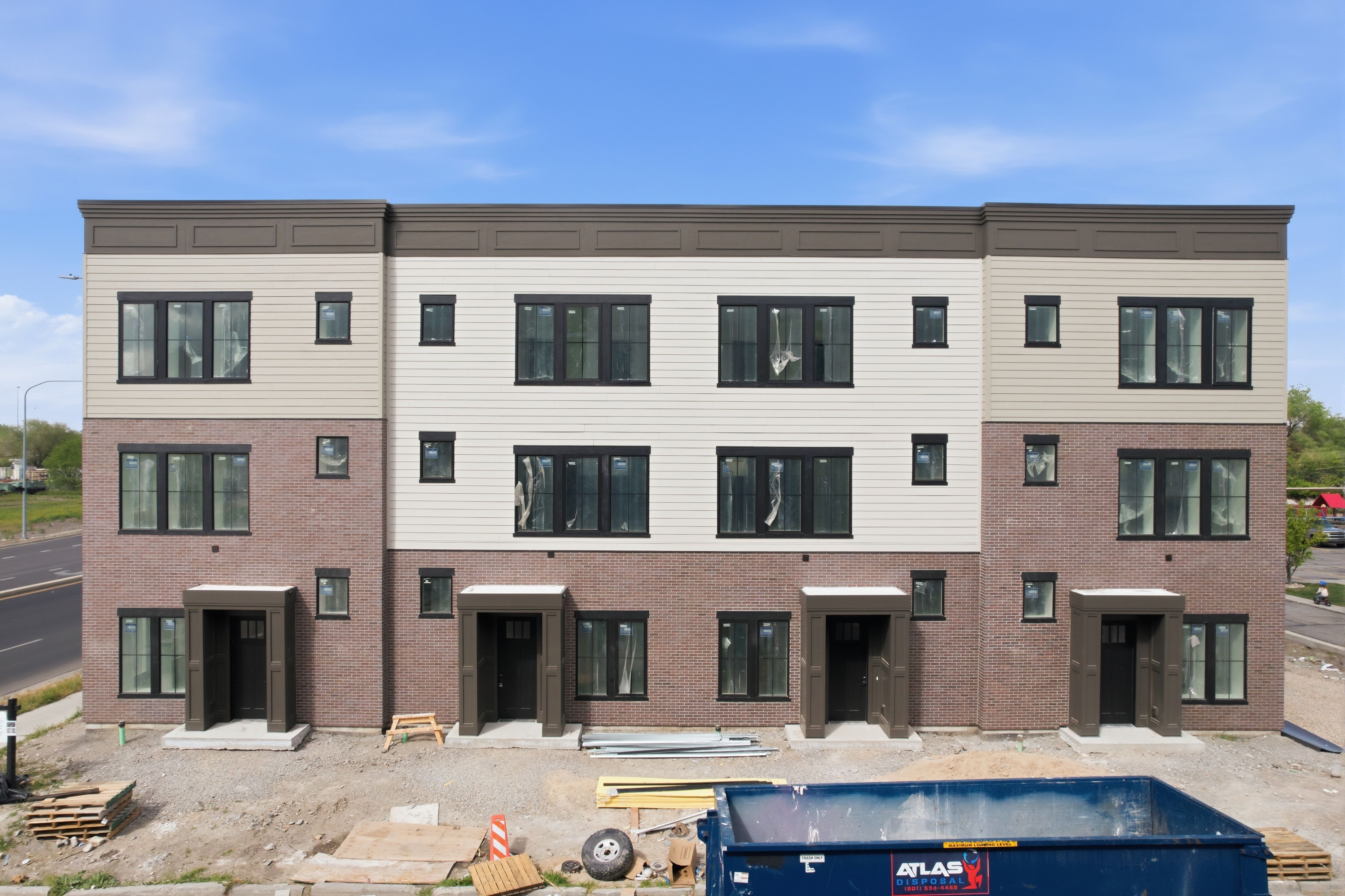 Rear view of house featuring brick siding